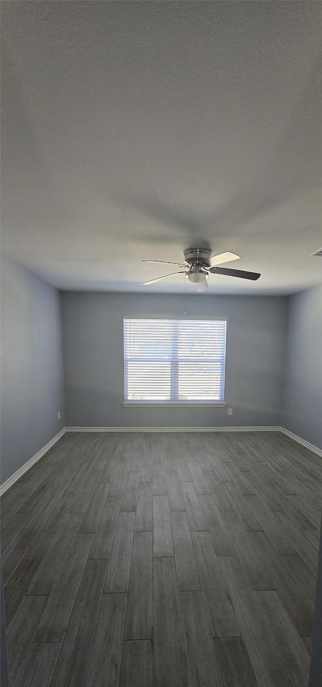 empty room with dark wood-type flooring