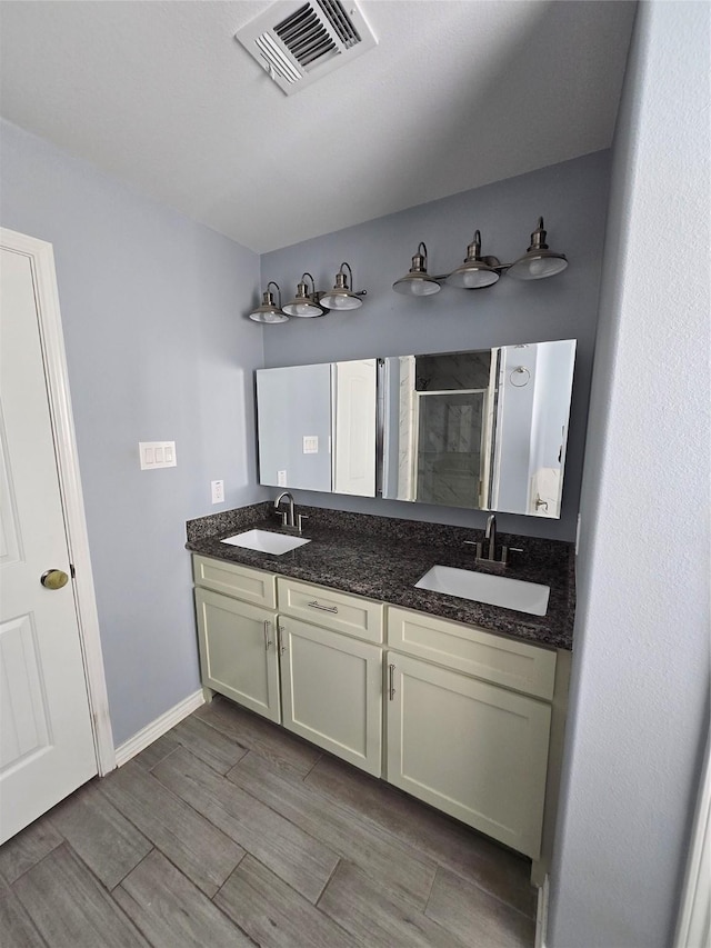 bathroom featuring vanity and walk in shower