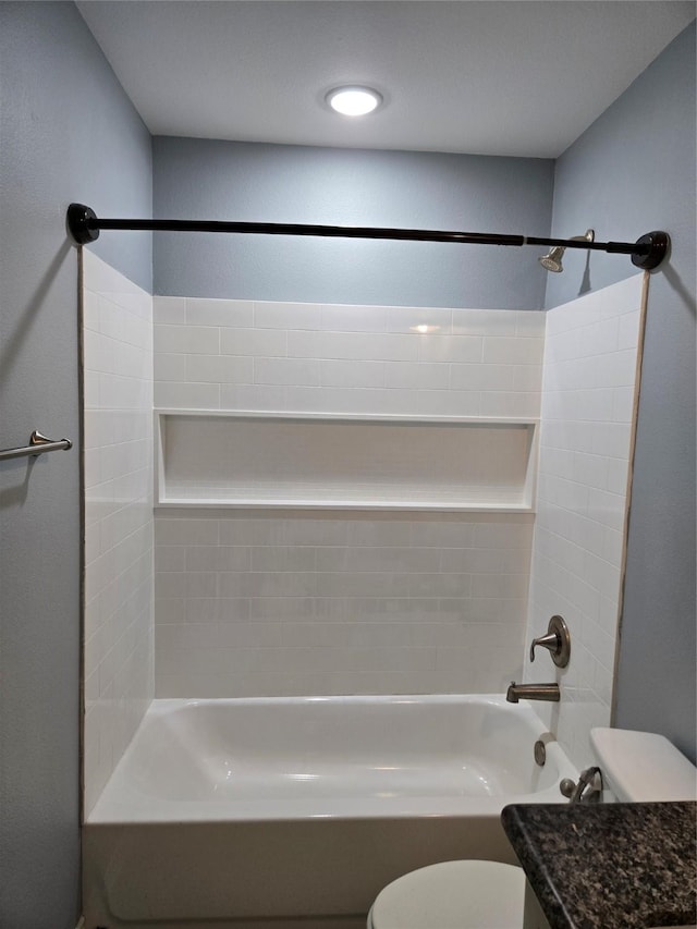 bathroom with shower / bath combination and toilet