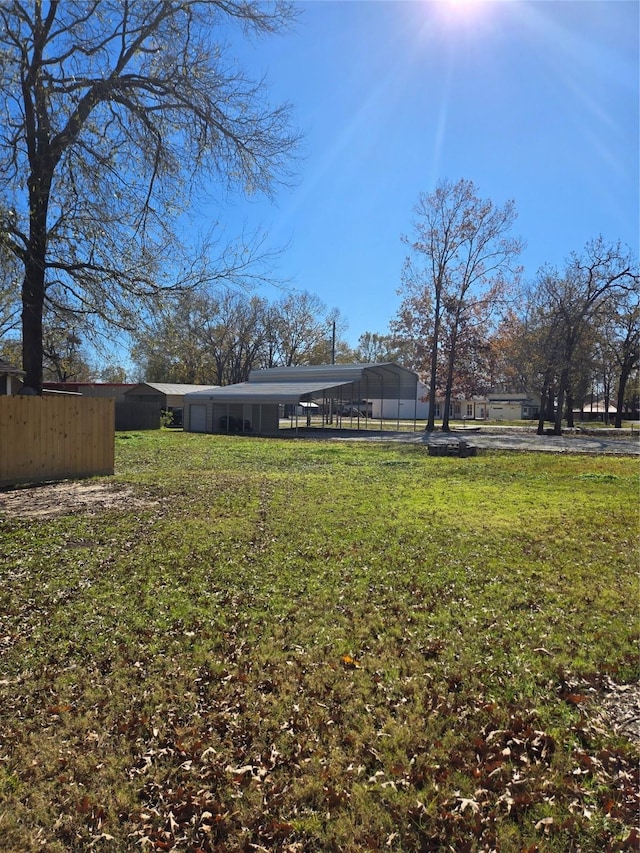 view of yard with a carport