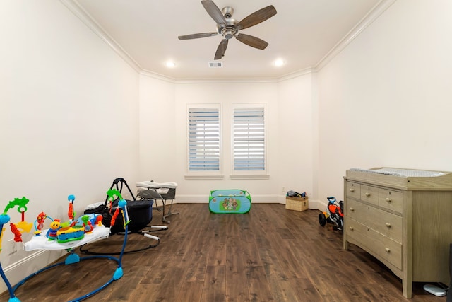 game room featuring ceiling fan, dark hardwood / wood-style flooring, and ornamental molding