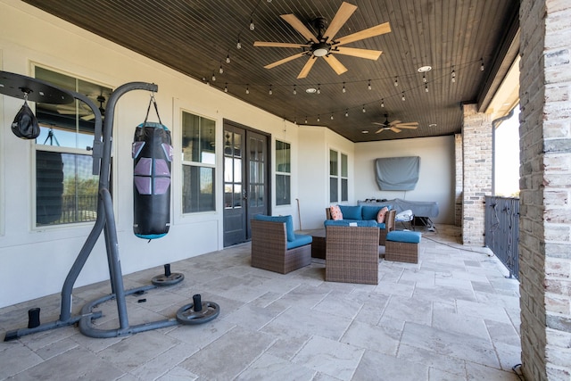 view of patio / terrace with ceiling fan and outdoor lounge area