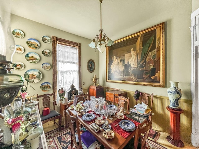 dining area featuring a notable chandelier