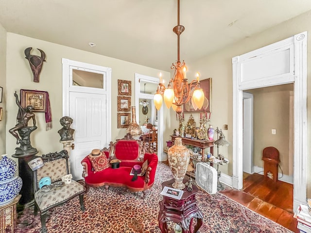 interior space with a notable chandelier and dark wood-type flooring