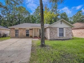 ranch-style home with a front lawn