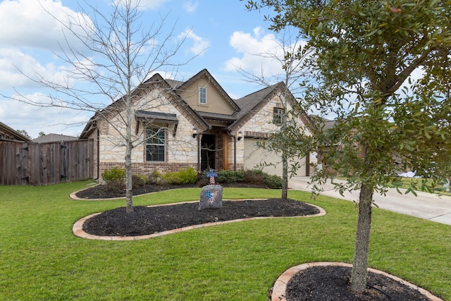 craftsman-style home with a front lawn and a garage