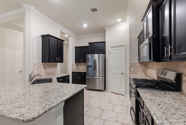 kitchen featuring light stone countertops, sink, and appliances with stainless steel finishes