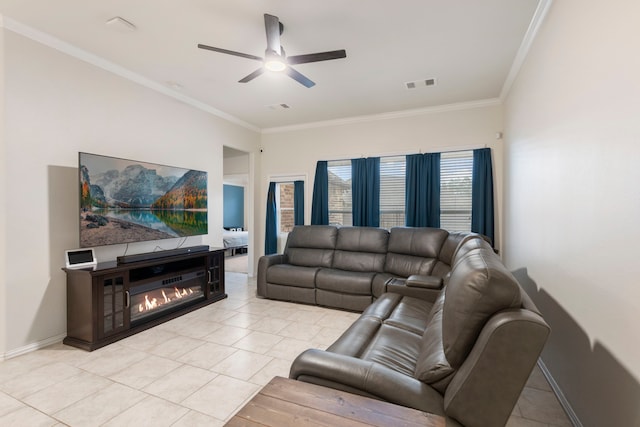 living room featuring ceiling fan, light tile patterned floors, and ornamental molding