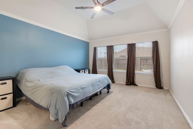 bedroom featuring ceiling fan, vaulted ceiling, light carpet, and crown molding