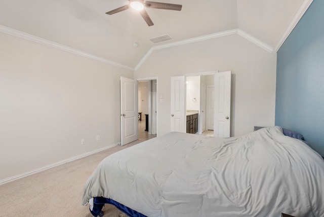 bedroom with ceiling fan, lofted ceiling, connected bathroom, and crown molding