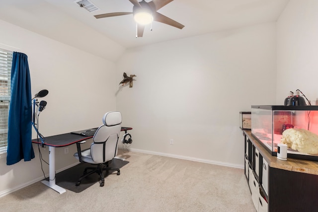 carpeted home office featuring ceiling fan and vaulted ceiling