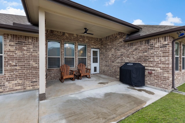 view of patio with ceiling fan and area for grilling