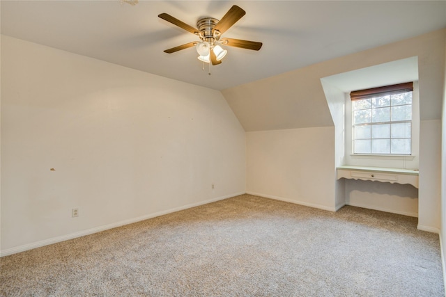 bonus room featuring carpet, lofted ceiling, and ceiling fan