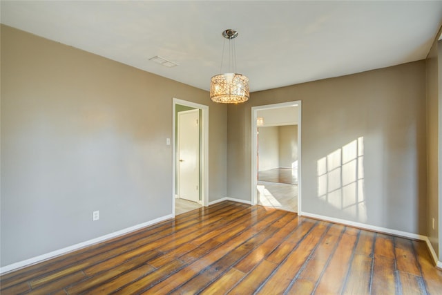 spare room with dark hardwood / wood-style floors