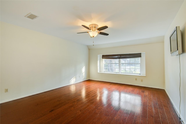 unfurnished room with ceiling fan and dark hardwood / wood-style flooring