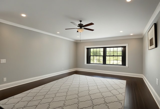 empty room featuring ceiling fan, ornamental molding, and dark hardwood / wood-style floors