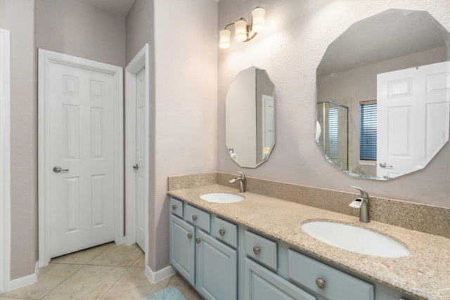 bathroom with vanity and tile patterned flooring