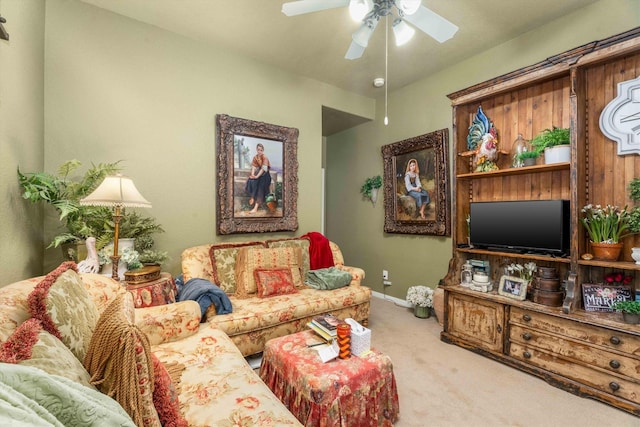 carpeted living room with ceiling fan