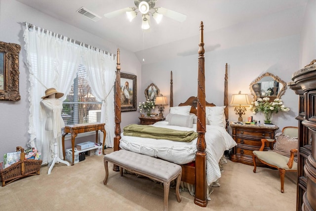 carpeted bedroom featuring ceiling fan and vaulted ceiling