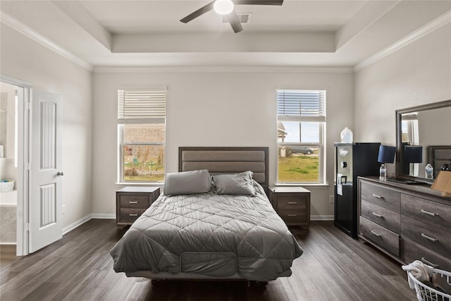 bedroom featuring ceiling fan, dark wood-type flooring, ornamental molding, and a raised ceiling