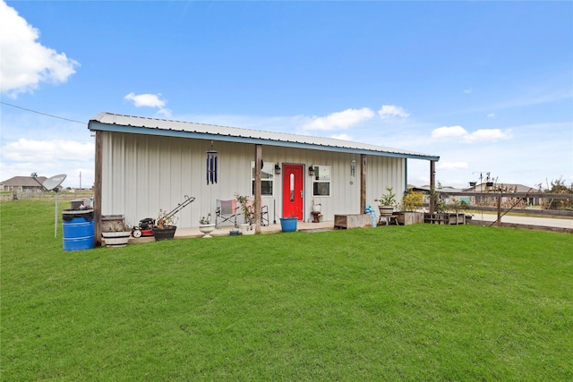 back of house with a yard