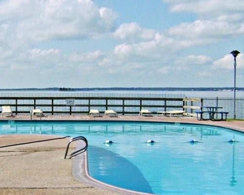 view of swimming pool with a water view