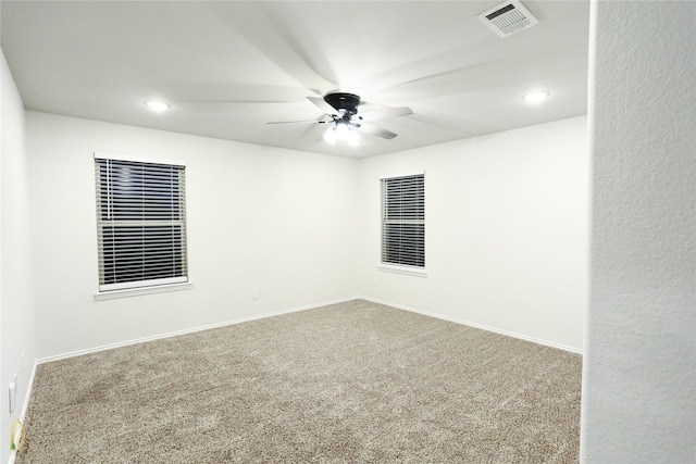 carpeted empty room with ceiling fan