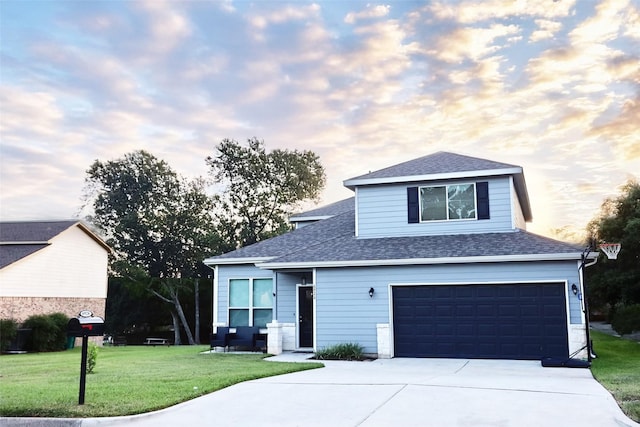 view of property with a yard and a garage