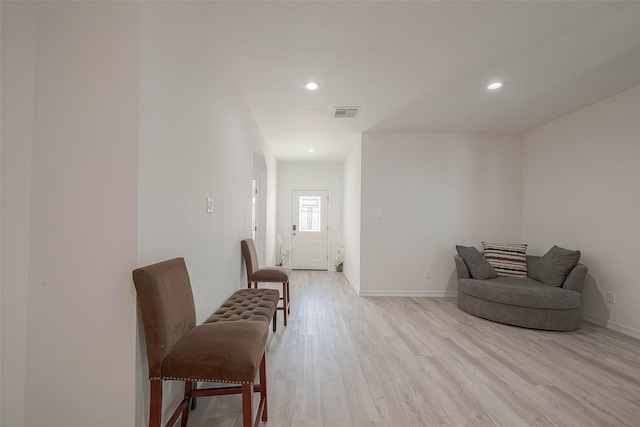 living area with light hardwood / wood-style floors