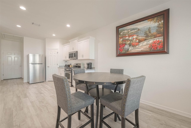 dining room featuring light wood-type flooring