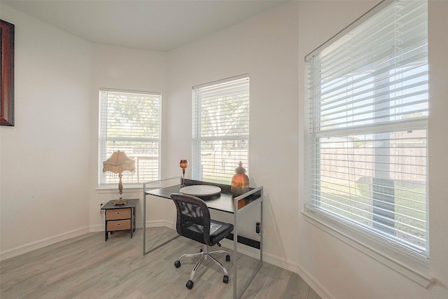 office space with light hardwood / wood-style floors