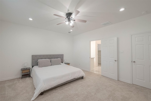 bedroom with ceiling fan and light colored carpet