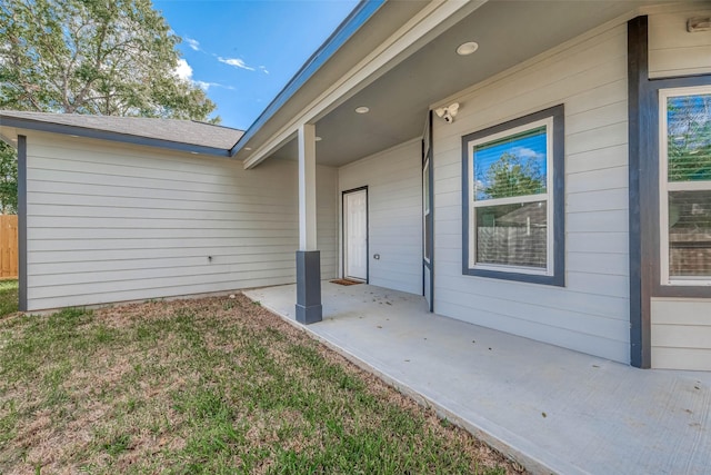 property entrance featuring a patio area