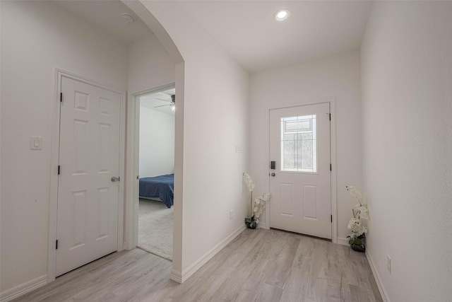 doorway to outside featuring light hardwood / wood-style floors and ceiling fan