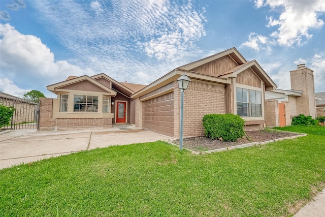 single story home with a front yard, brick siding, an attached garage, and driveway