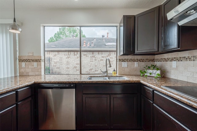 kitchen featuring under cabinet range hood, a sink, dark brown cabinetry, and stainless steel dishwasher