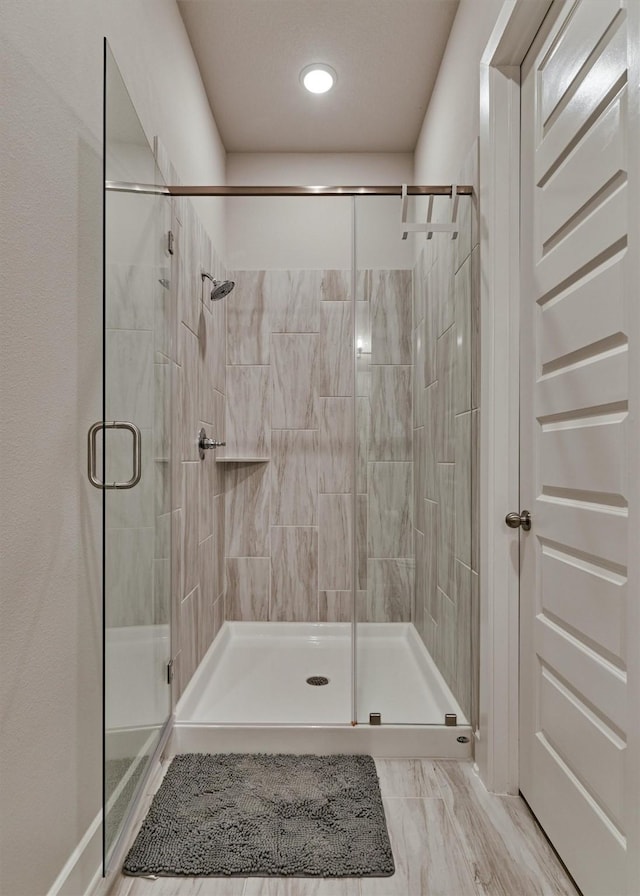 bathroom with an enclosed shower