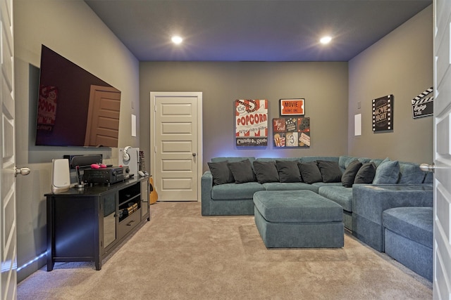 living room with recessed lighting and light colored carpet