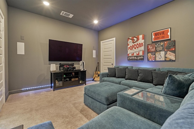 living area with baseboards, recessed lighting, visible vents, and light colored carpet