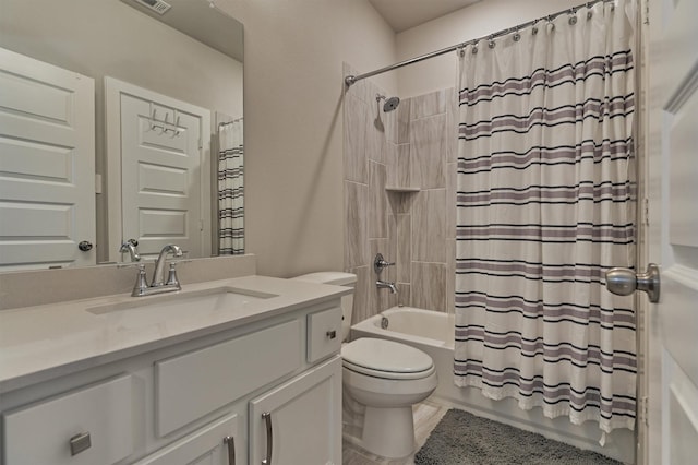 full bathroom featuring toilet, vanity, and shower / tub combo with curtain