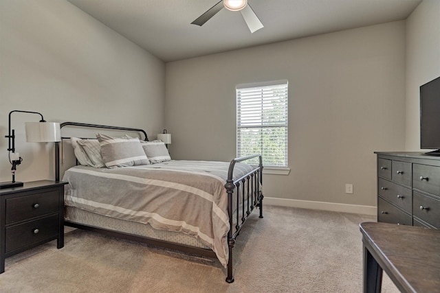 bedroom with light carpet and ceiling fan