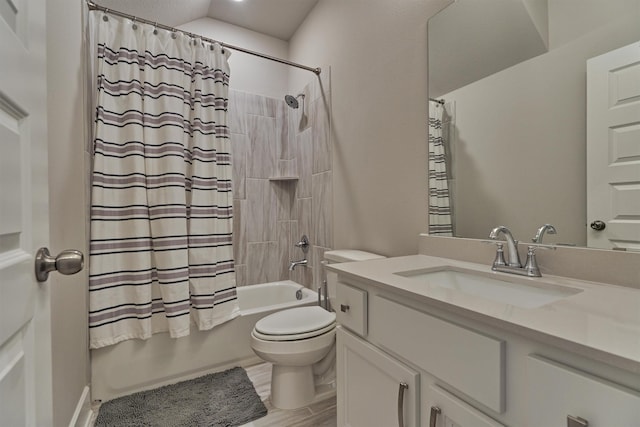 bathroom featuring shower / bath combo, vanity, toilet, and wood finished floors