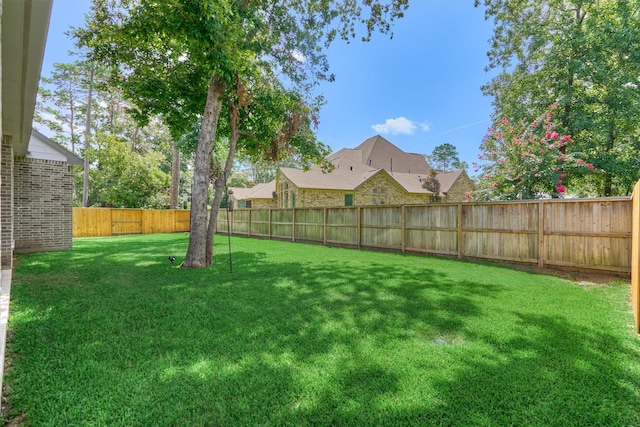 view of yard with a fenced backyard