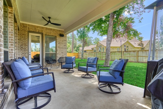 view of patio / terrace featuring ceiling fan, outdoor lounge area, and a fenced backyard