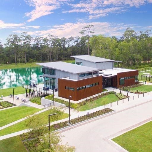 view of property's community featuring a water view and a lawn