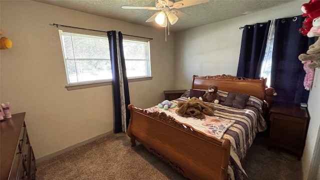 bedroom with ceiling fan, light colored carpet, and a textured ceiling