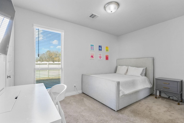 bedroom featuring light carpet