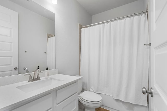 full bathroom featuring toilet, vanity, and shower / tub combo with curtain