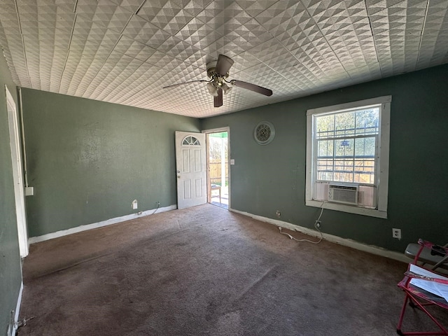 empty room featuring ceiling fan, carpet flooring, and cooling unit