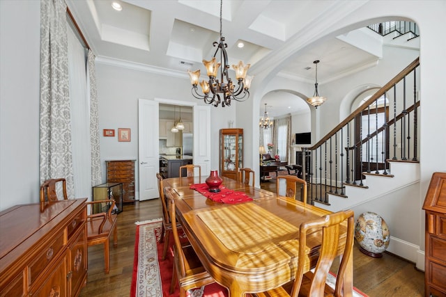 dining area with an inviting chandelier, coffered ceiling, dark hardwood / wood-style floors, crown molding, and beam ceiling